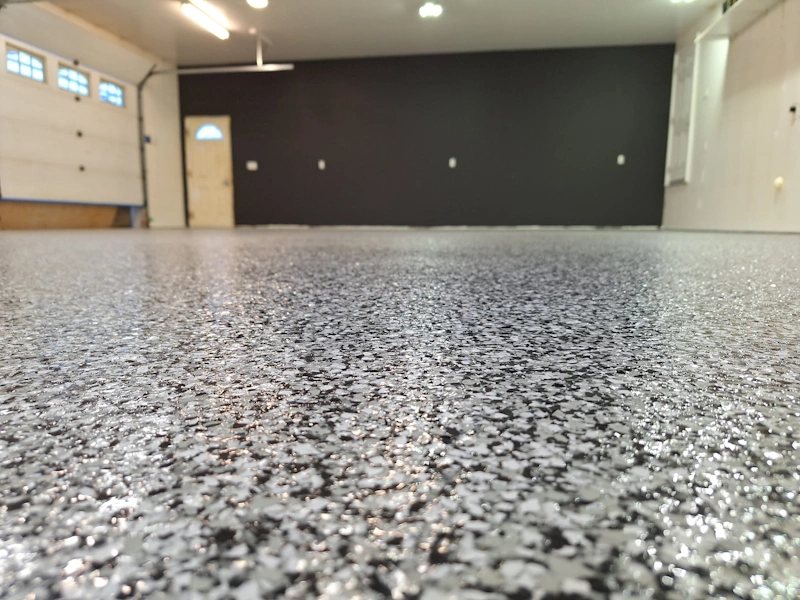 full flake with polyaspartic topcoat installed in a garage